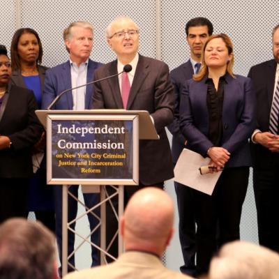 Lippman speaks at podium for Independent Commission