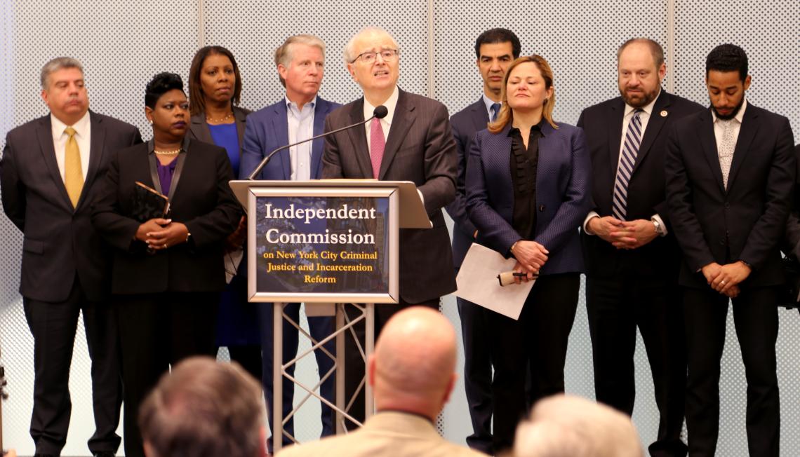 Lippman speaks at podium for Independent Commission