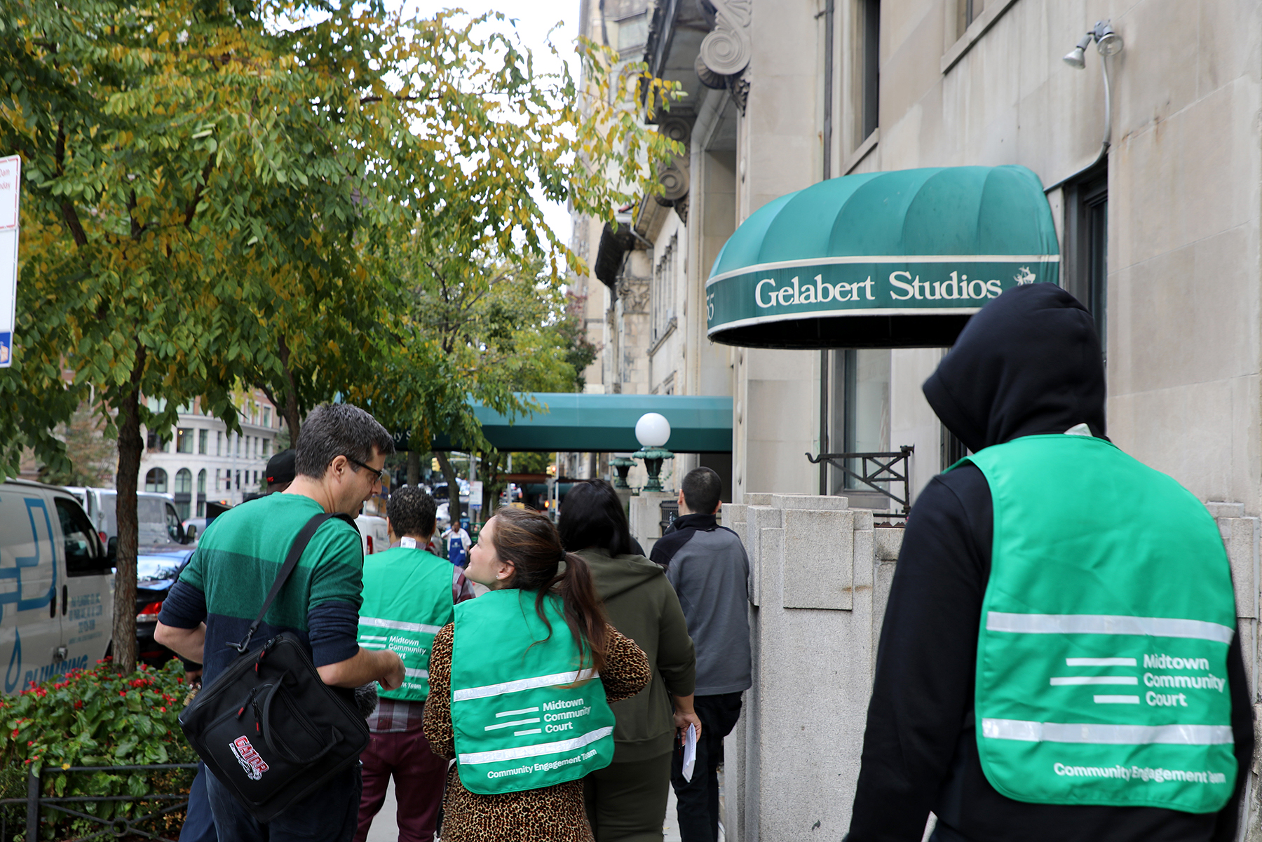 Community service staff and participants walk to the church