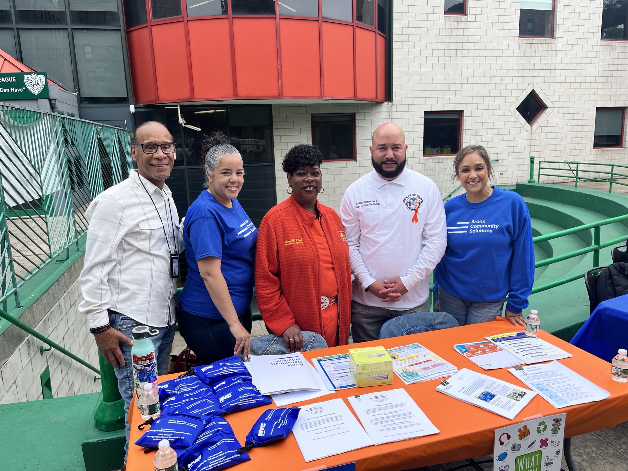 Bronx HOPE team poses with Councilmember Rafael Salamanca and Bronx District Attorney Darcel Clark at harm reduction table.