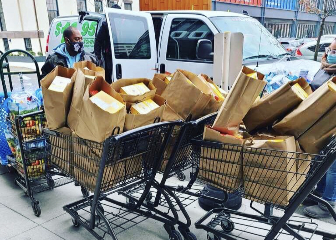 Brooklyn Justice Initiatives staff prepping to give bags of supplies to the community