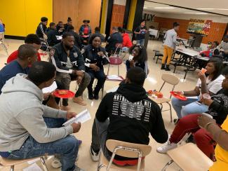 Bridging the Gap event; police and youth sit together in circle, building relationships