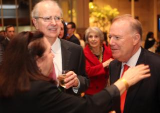 Senior Advisor to Mayor Bloomberg John Feinblatt, right, greets New York State Chief Judge Jonathan Lippman and Fund for the City of New York President Mary McCormick