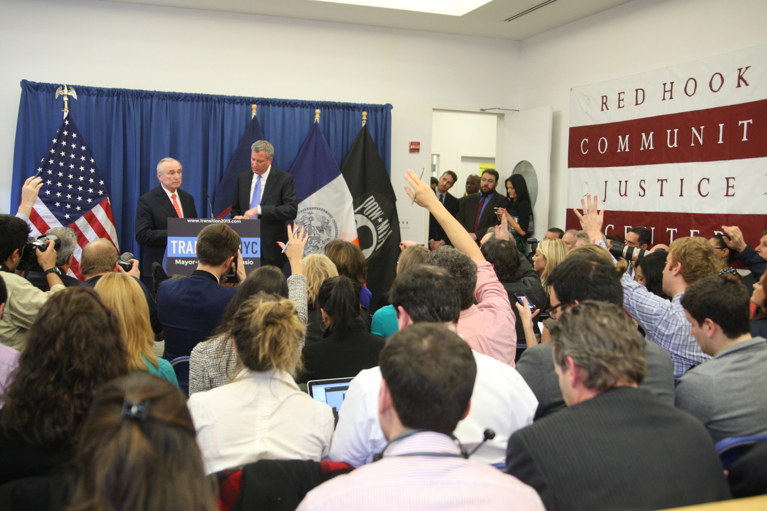 Reporters are eager to ask questions after Mayor-elect Bill de Blasio names William Bratton as police commissioner.