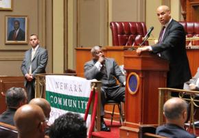 Newark Mayor Cory A. Booker speaks in the Municipal Council Chambers at the opening ceremony of Newark Community Solutions.