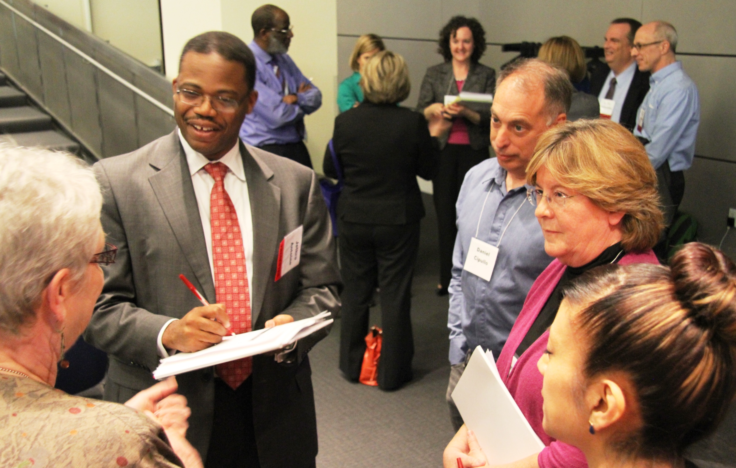 Summit attendees participate in a group exercise.