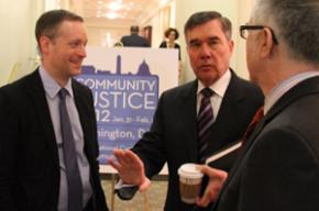 R. Gil Kerlikowske of the White House Office of National Drug Control Policy, center, speaks with Greg Berman, left, and Julius Lang of the Center for Court Innovation.