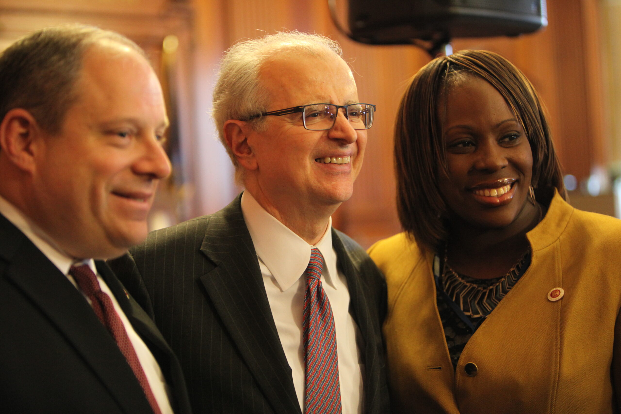 City Councilmembers Rory Lancman and Vanessa Gibson flank New York State Chief Judge Jonathan Lippman.