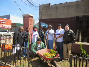 Cleaning up a Belmont Avenue community garden.
