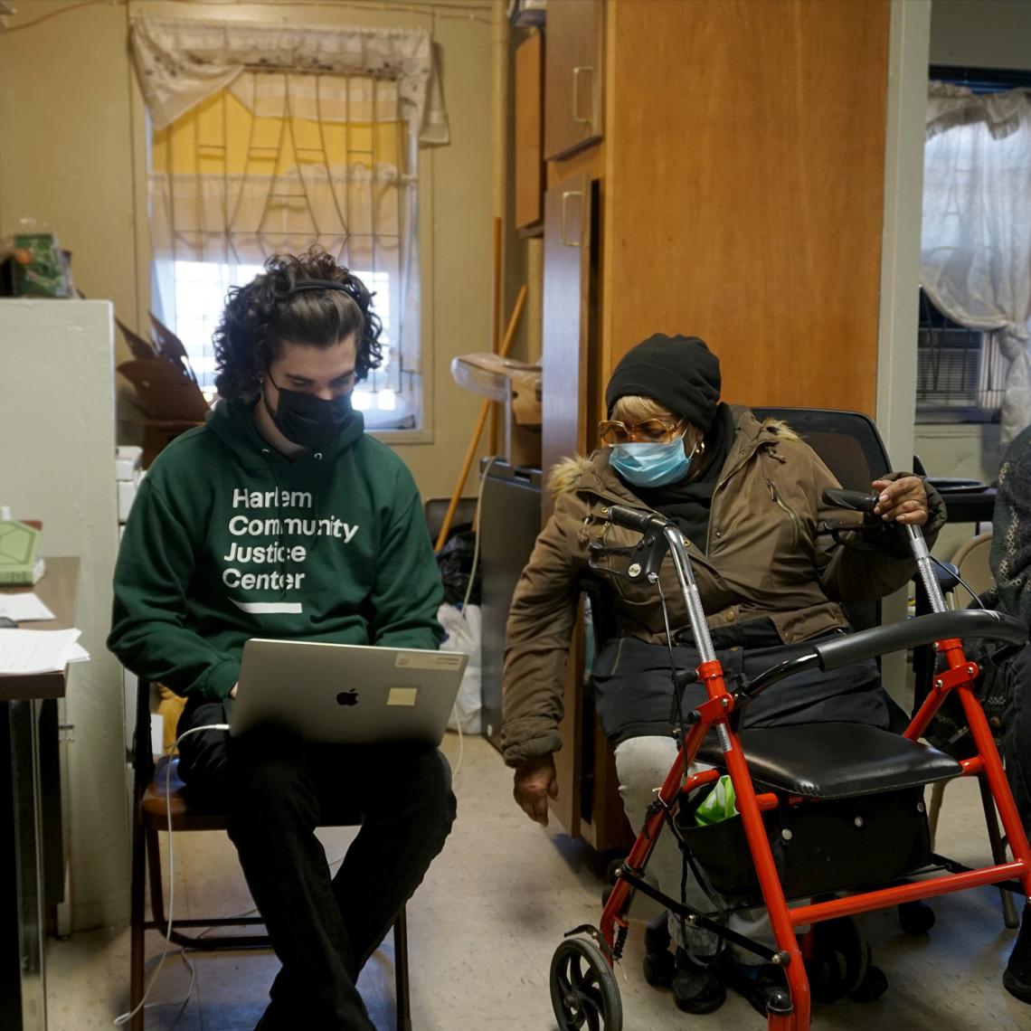 Harlem Housing Help Center staff with client