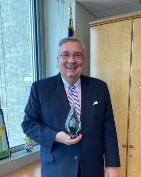 Judge Matthew D'Emic poses with his Lifetime Achievement Award