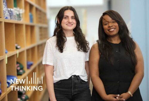 Clinical coordinator Mary-Ann Louis and mental health counselor Marie Tsalughelashvili smiling together in front of blurred bookshelf in background.