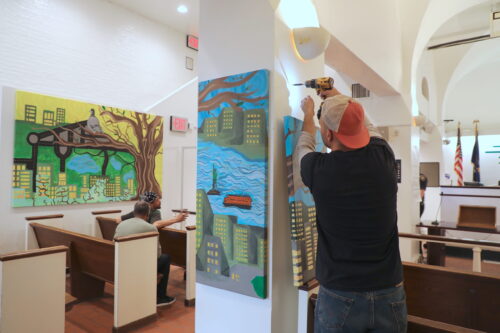 Artistic Noise painting being installed at Midtown Community Justice Center's court house.