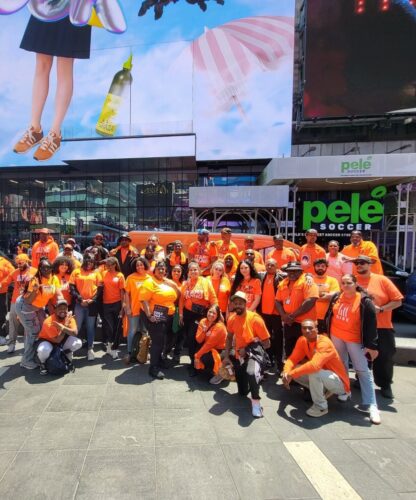 Group staff photo in Times Square for Gun Violence Awareness Month event.