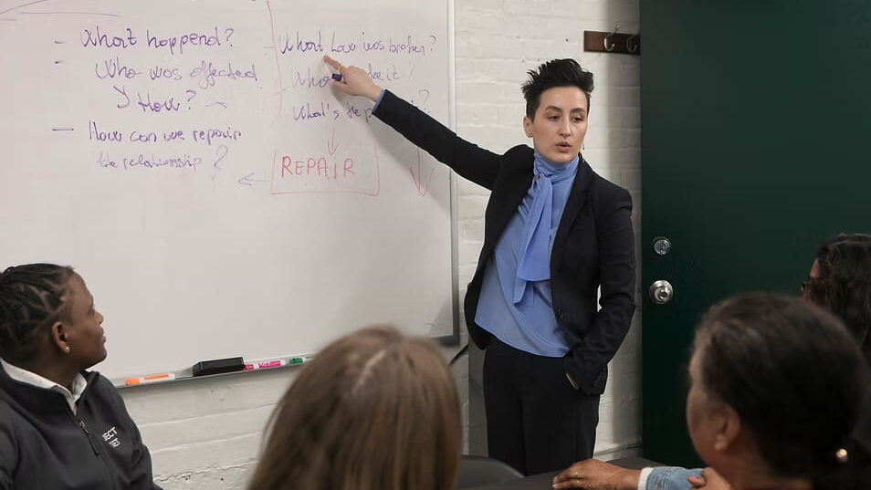 Project Director Sonila Kada leads a meeting with Reset team members