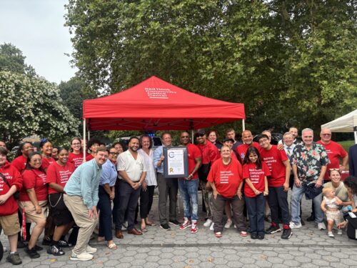 Group of people smiling at National Night Out Event.