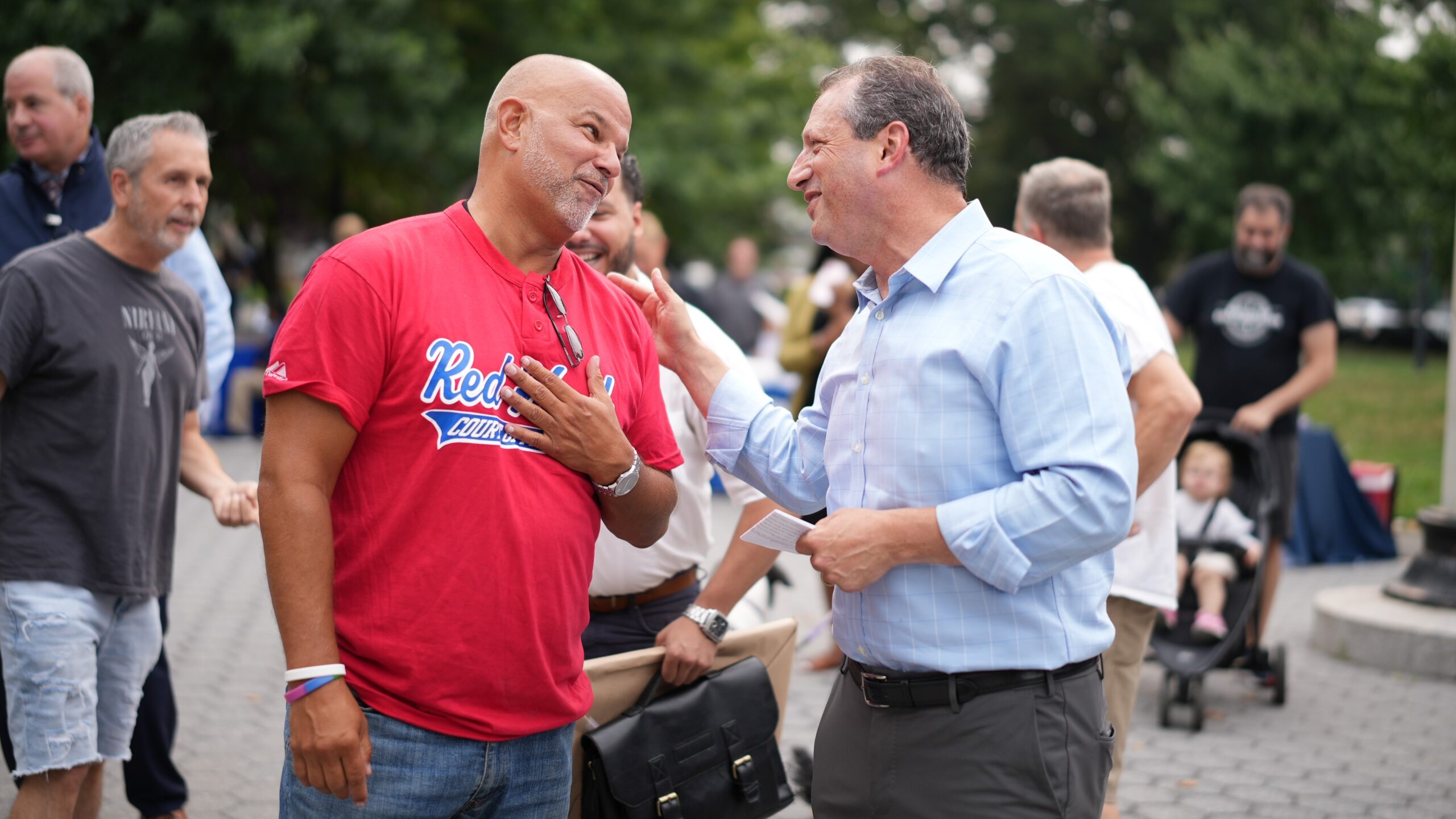 The Center for Justice Innovation's James Brodick speaks with Comptroller Brad Lander at Red Hook National Night Out.