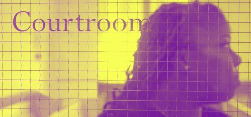 Woman stands inside courtroom