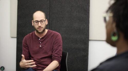 Alex Genty-Waksberg speaking in restorative justice circle